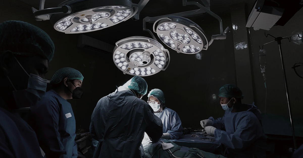 Surgeon operating beneath bright surgical lights in a South African hospital