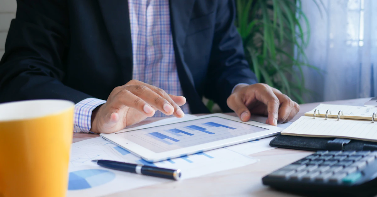Business professional reviewing financial data on tablet